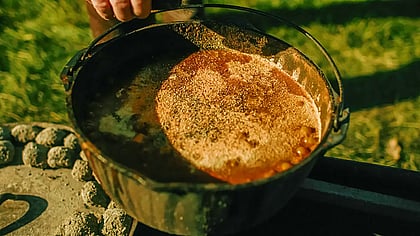 Beans boiling in a Dutch Oven over an open fire