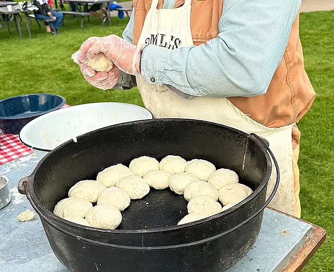 Making Dutch Oven Biscuits with Gloves